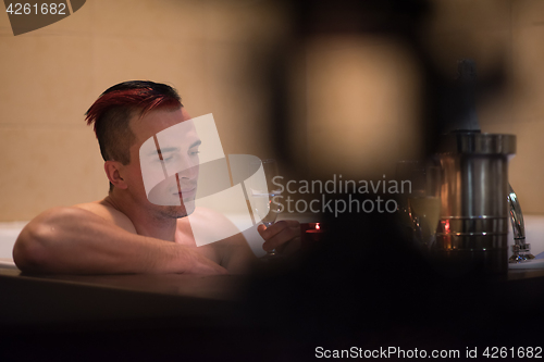 Image of man relaxing in the jacuzzi