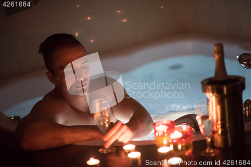 Image of man relaxing in the jacuzzi