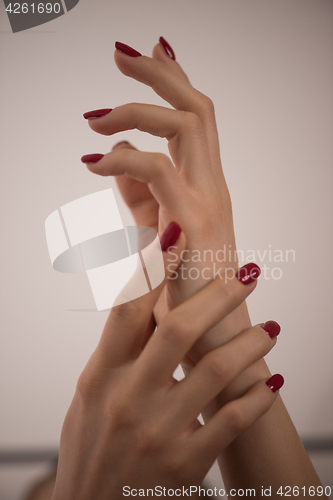 Image of closeup of hands of a young woman