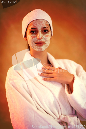 Image of Spa Woman applying Facial Mask