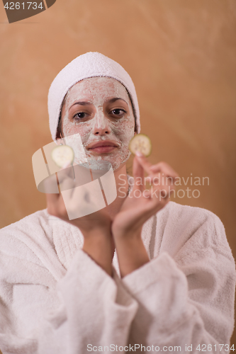 Image of Spa Woman applying Facial Mask