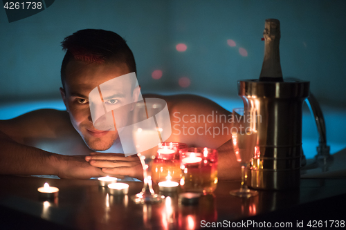 Image of man relaxing in the jacuzzi