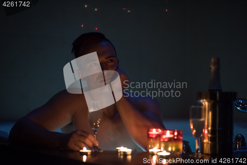 Image of man relaxing in the jacuzzi