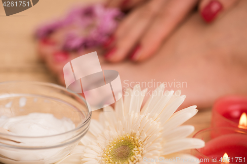 Image of female feet and hands at spa salon