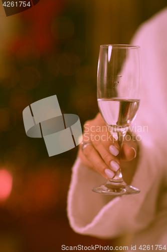 Image of woman drinking champagne at spa