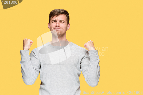 Image of The young man with a raised fist