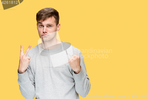 Image of The young man with a raised fist