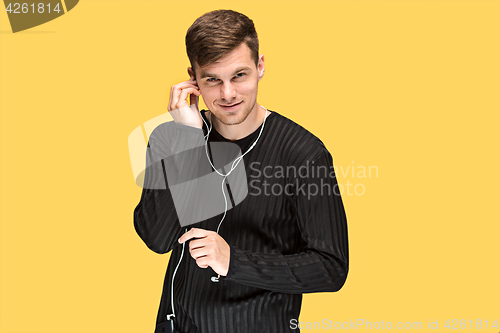 Image of The young man smiling and looking at camera