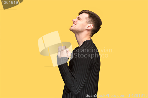 Image of The young man with a raised fist