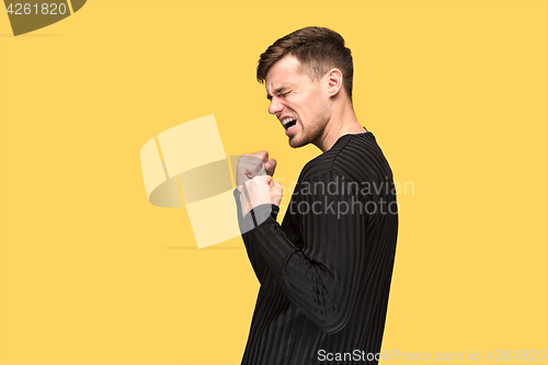 Image of The young man with a raised fist