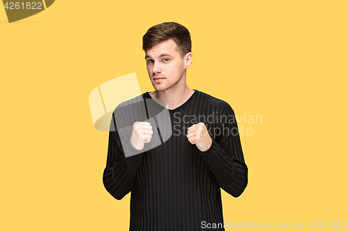 Image of The young man with a raised fist