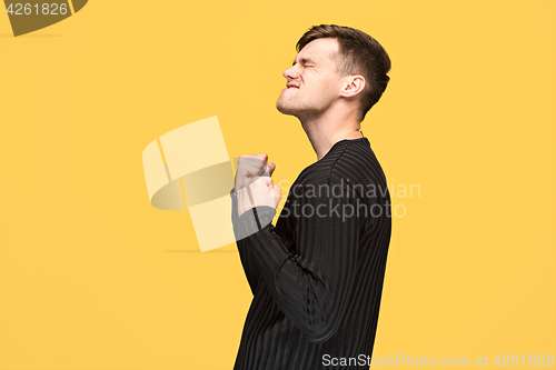 Image of The young man with a raised fist