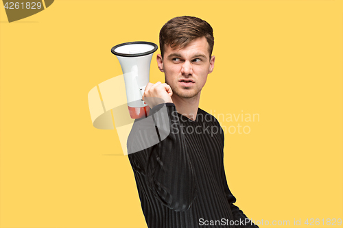 Image of The young man holding a megaphone