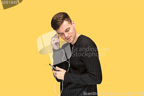Image of The young man smiling and looking away