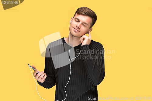 Image of The young man smiling and looking away