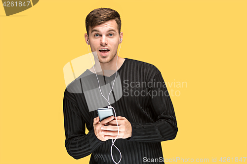 Image of The young man smiling and looking away