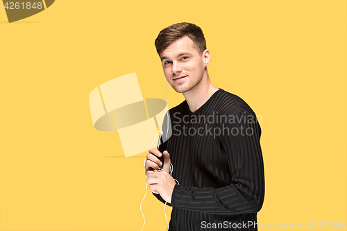 Image of The young man smiling and looking away