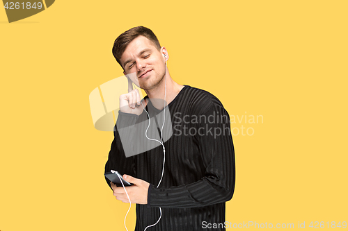 Image of The young man smiling and looking away