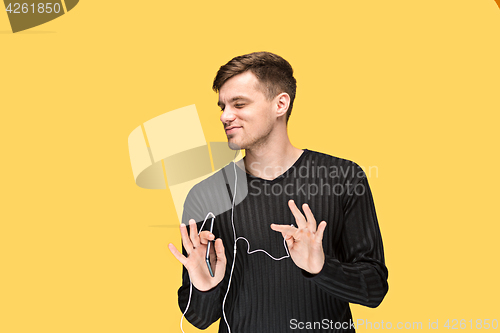 Image of The young man smiling and looking away