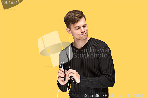Image of The young man smiling and looking away