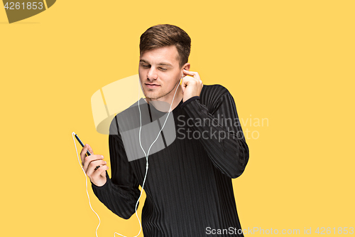 Image of The young man smiling and looking away