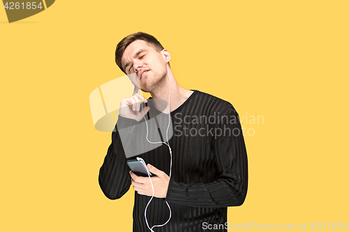 Image of The young man smiling and looking away