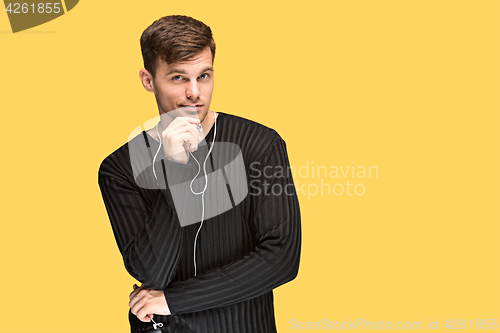 Image of The young man smiling and looking away