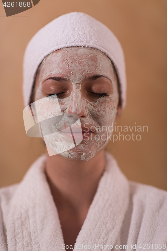 Image of Spa Woman applying Facial Mask