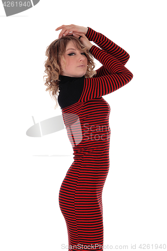 Image of Beautiful woman in a red striped dress.