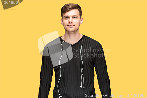 Image of The young man smiling and looking away