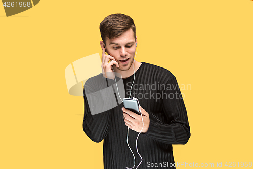 Image of The young man smiling and looking away