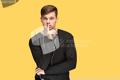 Image of The young man smiling and looking away