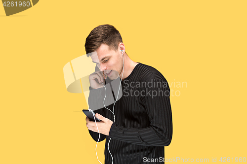 Image of The young man smiling and looking away