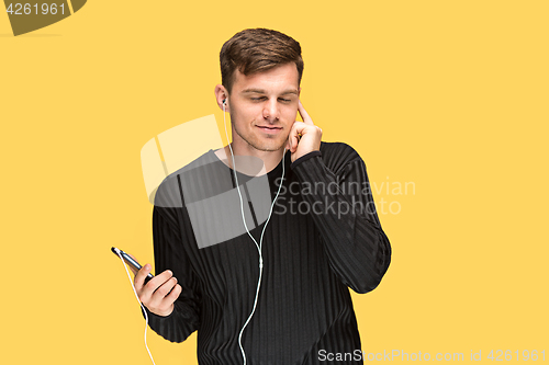 Image of The young man smiling and looking away