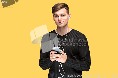 Image of The young man smiling and looking away