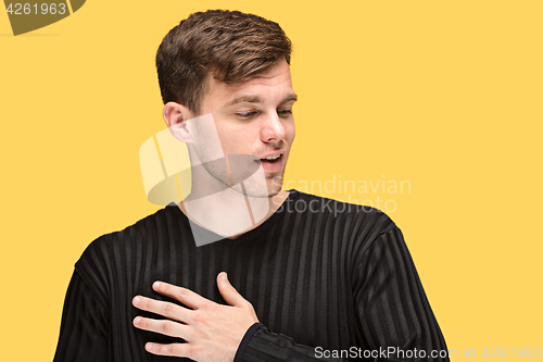Image of The young man smiling and looking away