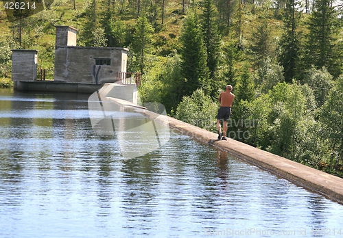 Image of Man on an old dam