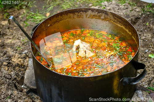 Image of Hot soup in a tourist bowler on a picnic