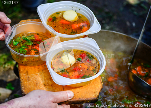 Image of Hot soup in a tourist bowler on a picnic