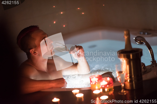 Image of man relaxing in the jacuzzi