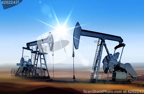 Image of oil pumps at sunset