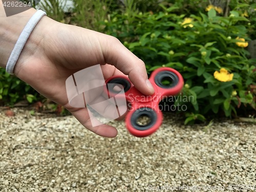 Image of Girl holding popular new spinner gadget