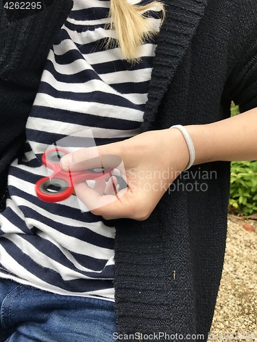 Image of Girl holding popular new spinner gadget