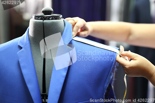 Image of Men seamstress, a suit made to measure.