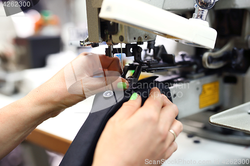 Image of Seamstress on the machine.