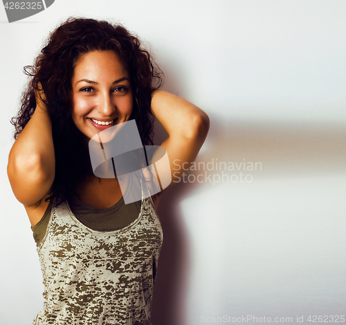 Image of young pretty stylish hipster girl posing emotional isolated on w