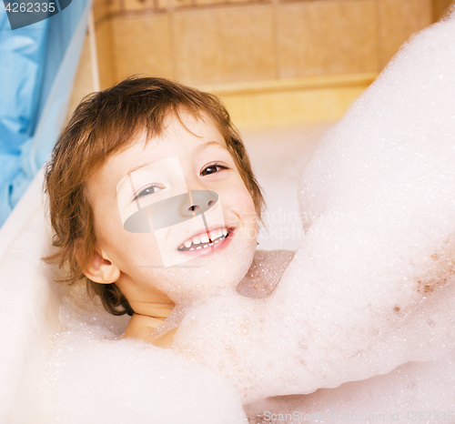 Image of little cute boy in bathroom with bubbles close up smiling, lifes