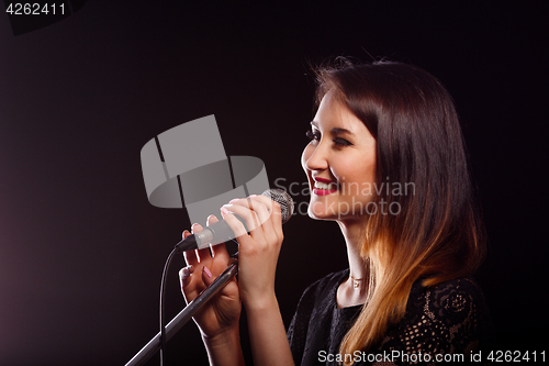 Image of Photo of singer with microphone