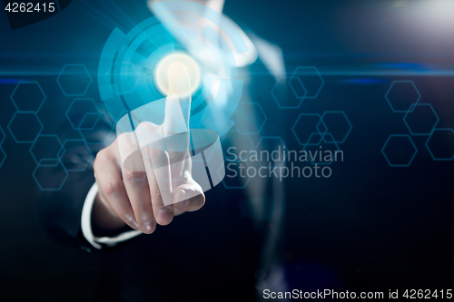 Image of Businessman touching buttons on screen