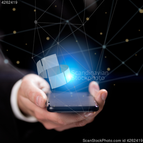 Image of Man holding blue crystal ball